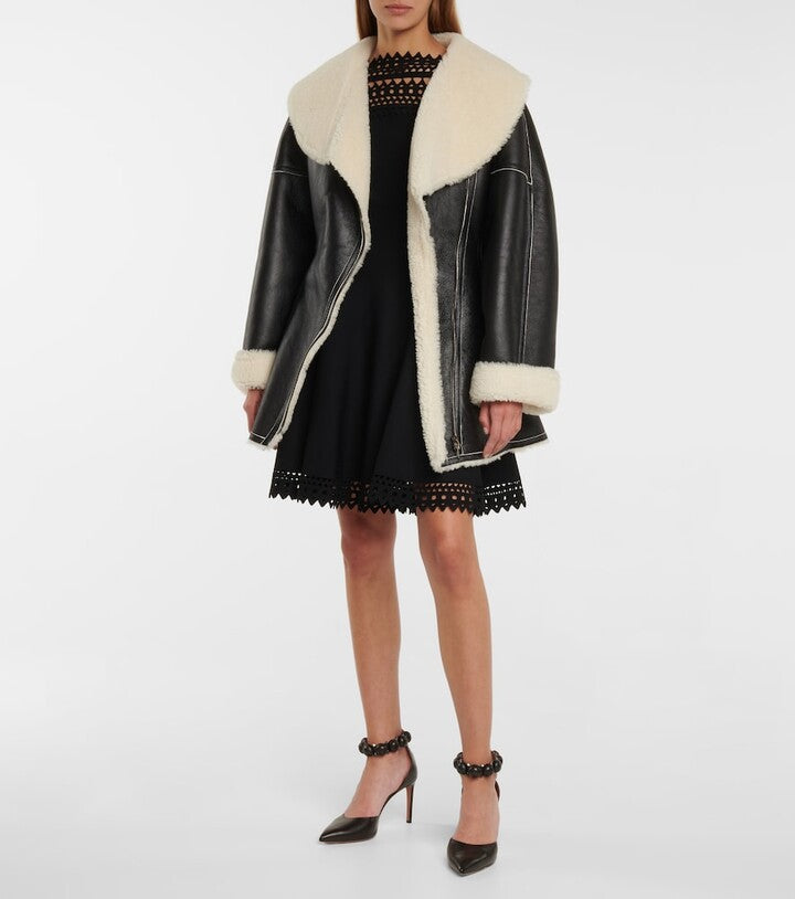 Black leather jacket with shearling on cuffs and collar, panel detailing, versatile as both jacket and dress – Movenera.