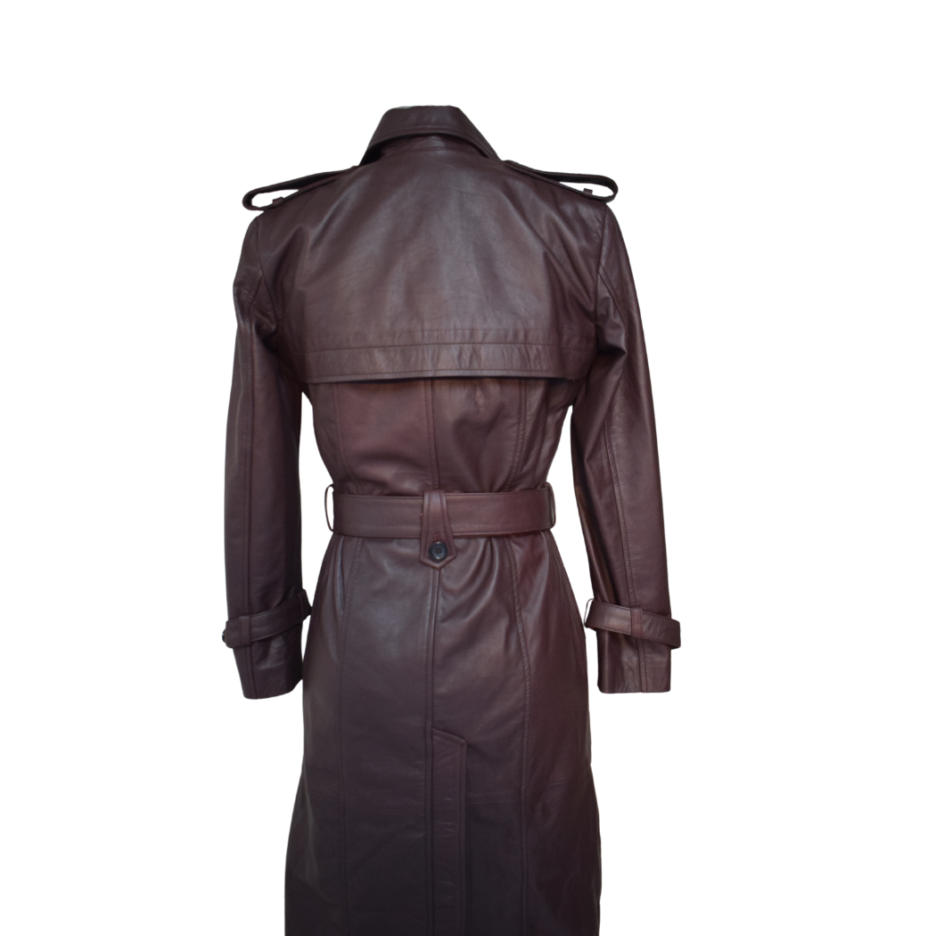 The back of a burgundy leather trench coat, showcasing full-length sleeves with wrist straps, shoulder straps, and an adjustable belt for a tailored fit. The coat is fully lined and features a double-breasted style for elegance.