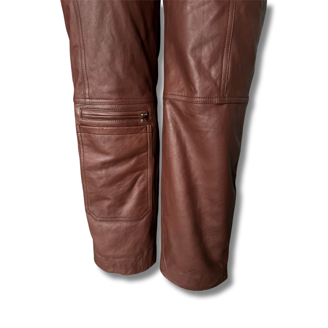 Brown genuine lambskin leather biker jumpsuit with asymmetrical center front zipper, thigh-deep pockets, knee pocket, back hemline zippers, and wrist zippers for style and functionality – Movenera.