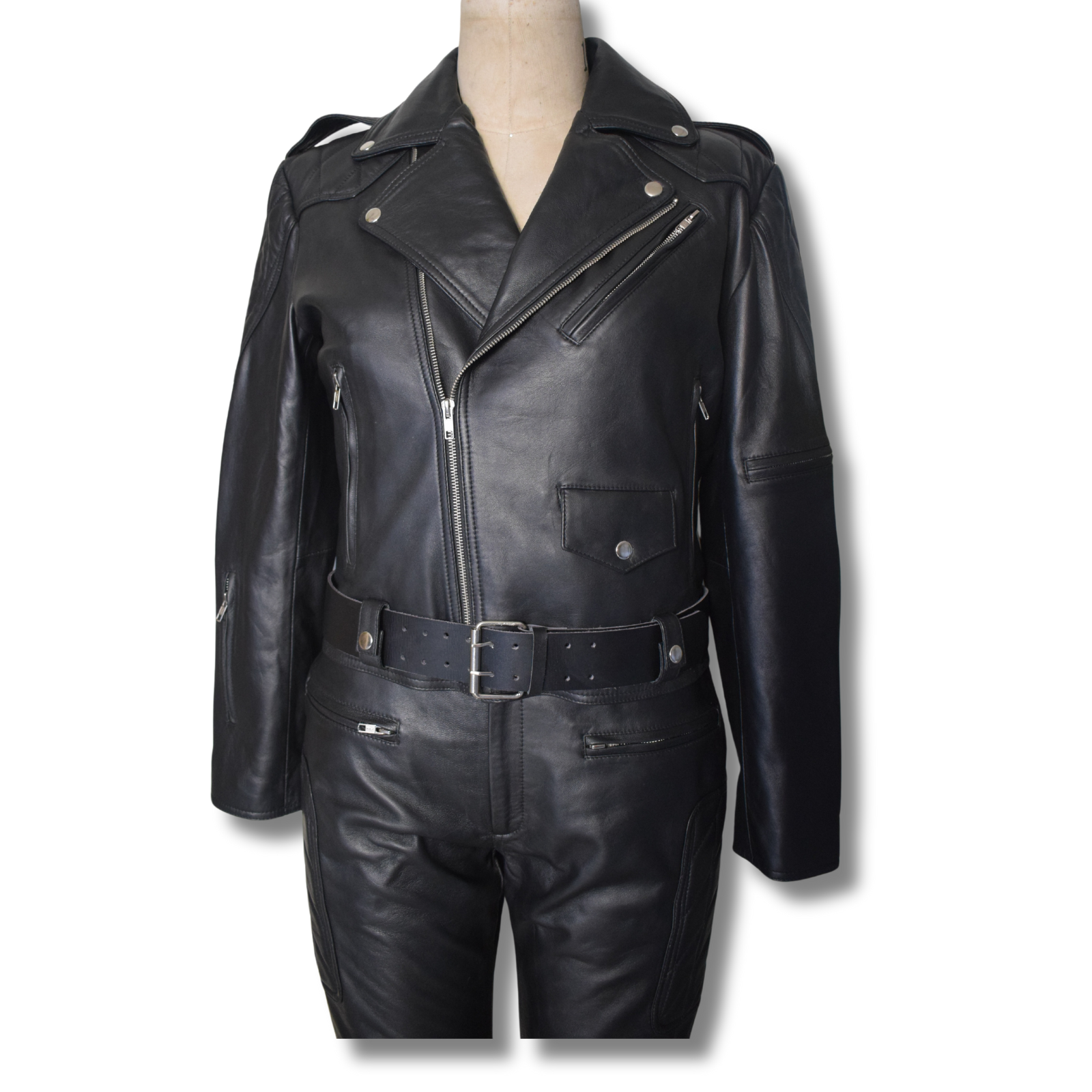 Discover our black genuine leather two-piece set featuring a lapel collar jacket with multiple body pockets and a waist belt, paired with pants that include front zipper pockets and quilted knee padding for extra protection. This durable, versatile, and timeless set combines style and functionality.